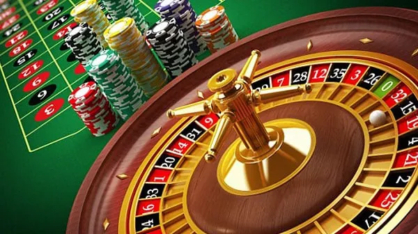 Live Poker table with a dealer and poker chips